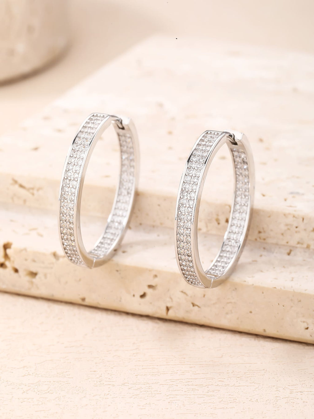 Double-row white cubic zirconia hoop earrings in hallmarked, rhodium-plated 925 sterling silver – display view – DRESCHER Jewellery®