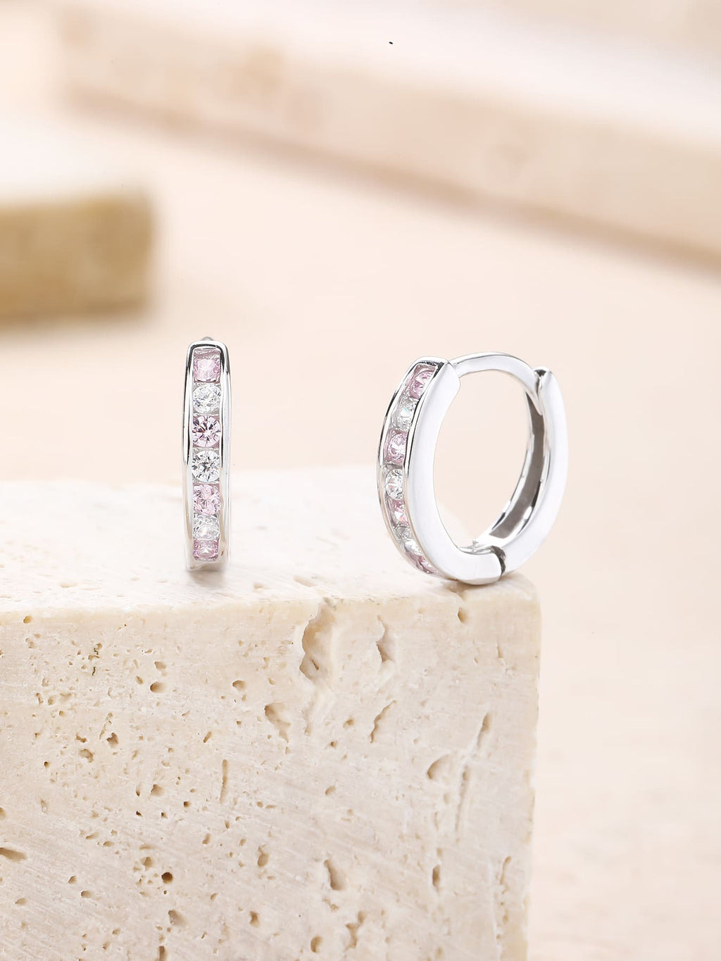 Pink and white cubic zirconia hoop earrings in hallmarked, rhodium-plated 925 sterling silver – lifestyle view – DRESCHER Jewellery®