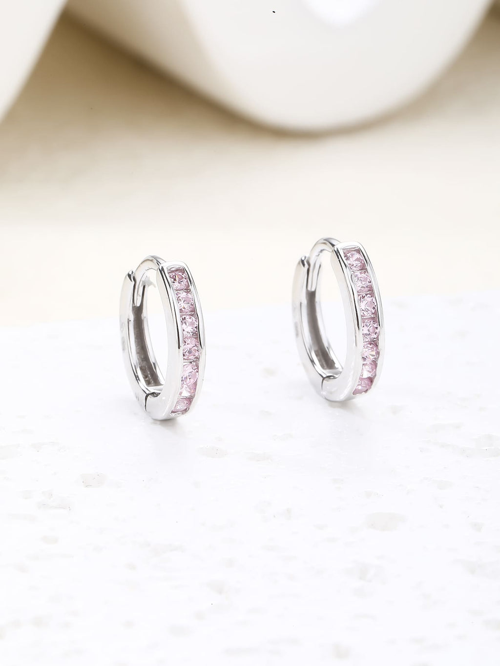 hoop earrings with pink stones in hallmarked, rhodium-plated 925 sterling silver – lifestyle view – DRESCHER Jewellery®