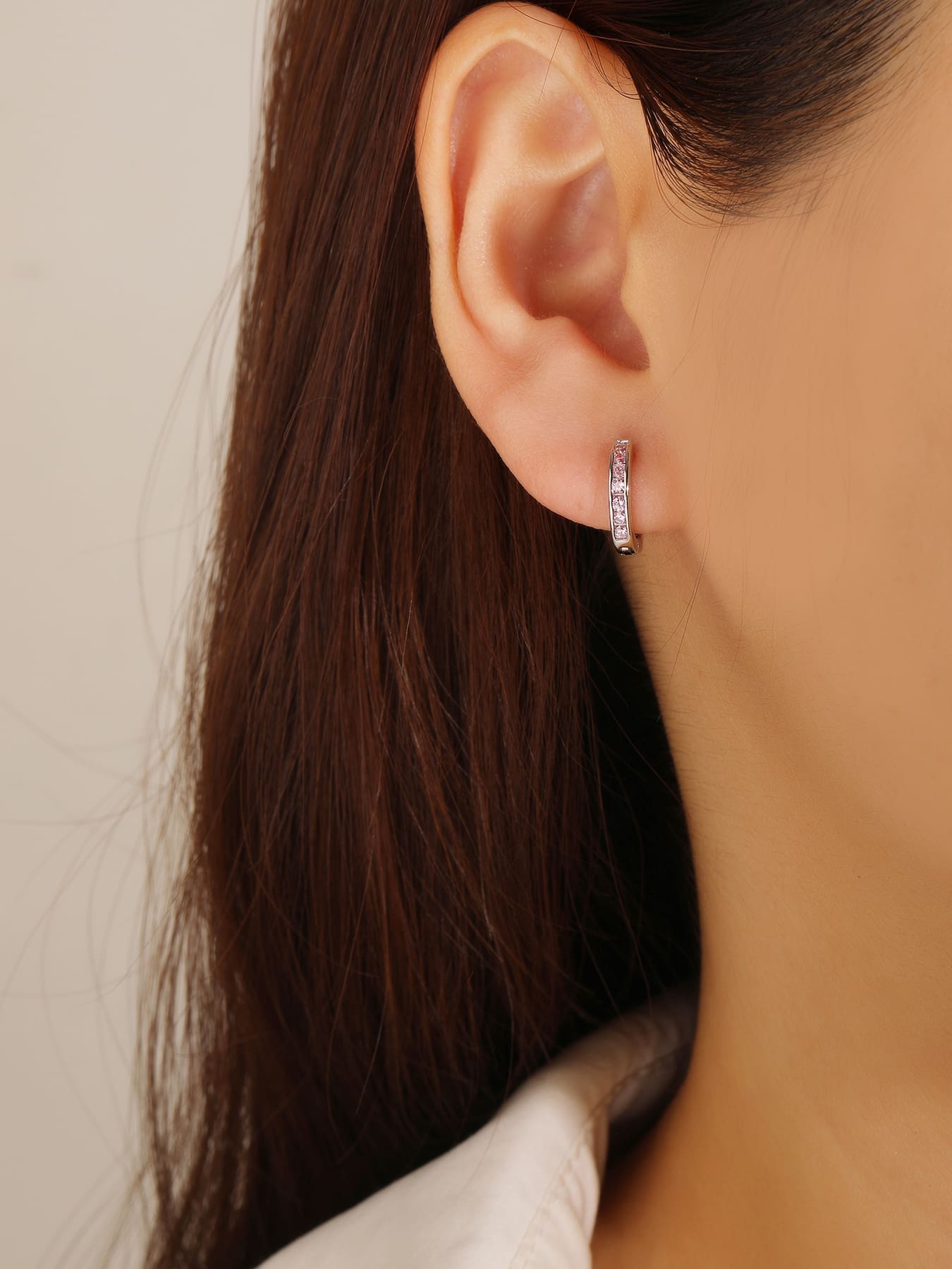 hoop earrings with pink stones in hallmarked, rhodium-plated 925 sterling silver – worn view – DRESCHER Jewellery®