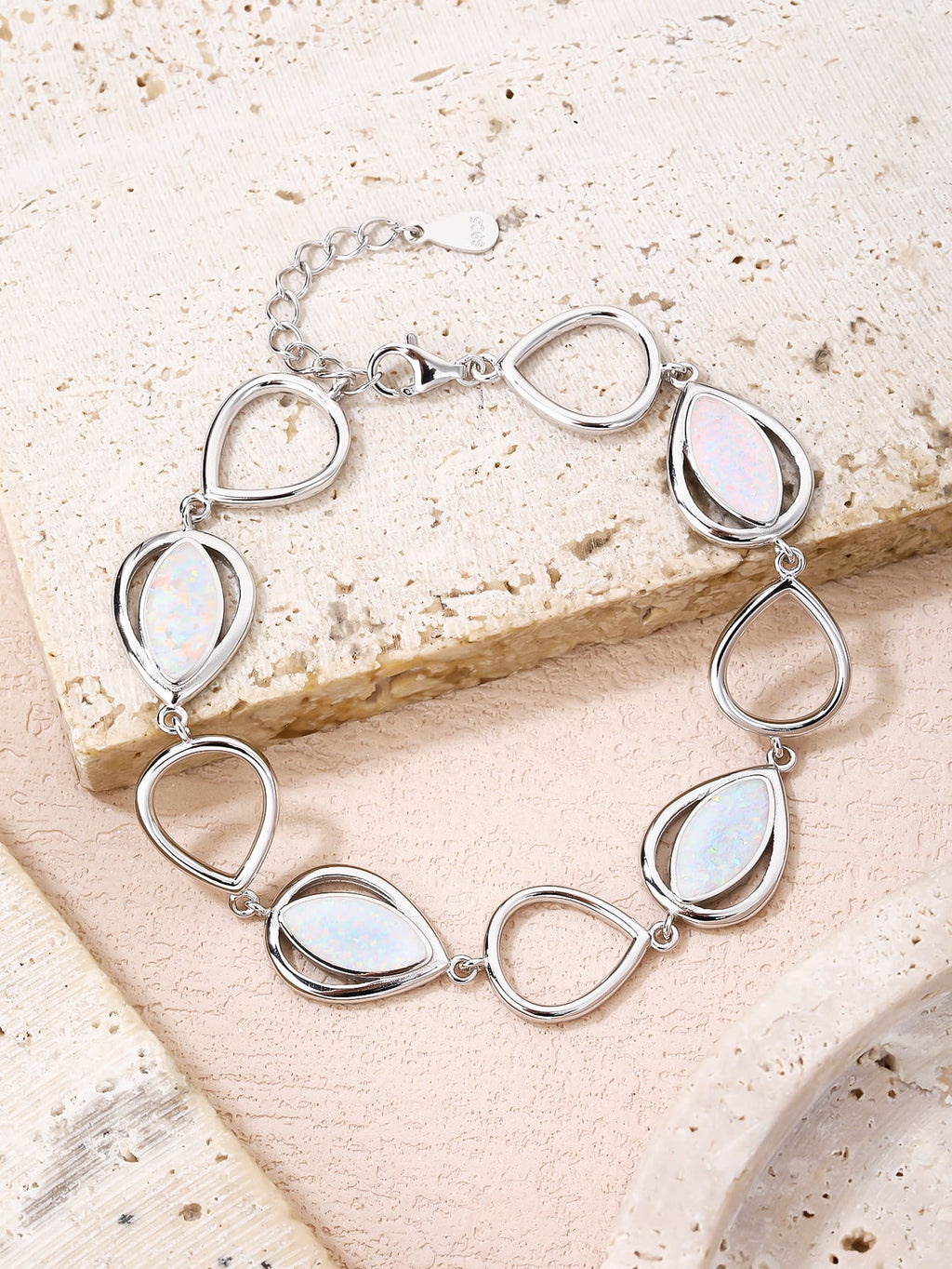 bracelet with drop outline and white opal stones (16,5+3,5 cm) in hallmarked, rhodium-plated 925 sterling silver – display view – DRESCHER Jewellery®