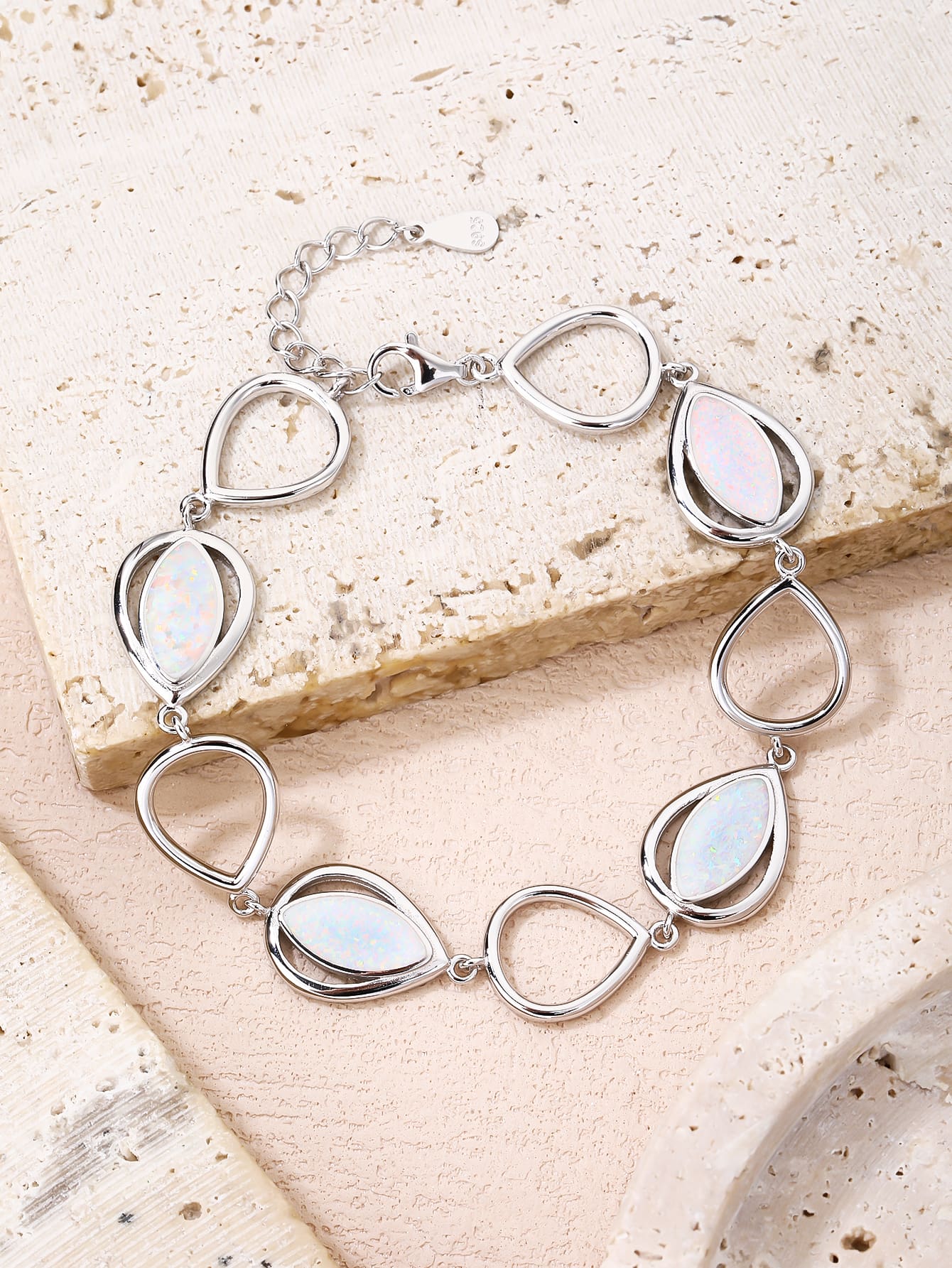 bracelet with drop outline and white opal stones (16,5+3,5 cm) in hallmarked, rhodium-plated 925 sterling silver – display view – DRESCHER Jewellery®