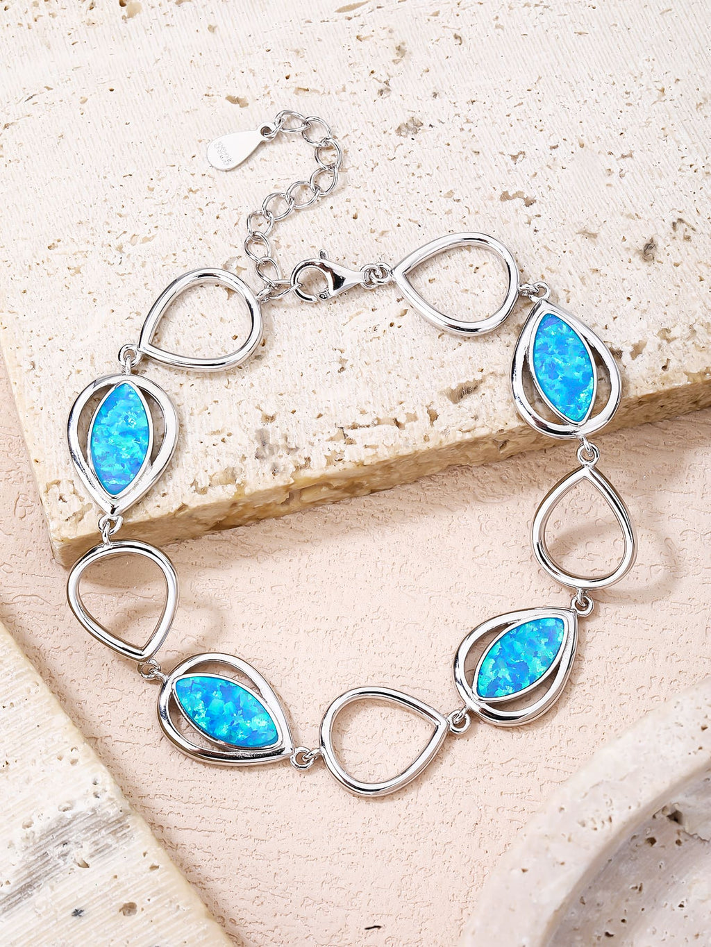 bracelet with drop outline and blue opal stones (16,5+3,5 cm) in hallmarked, rhodium-plated 925 sterling silver – display view – DRESCHER Jewellery®