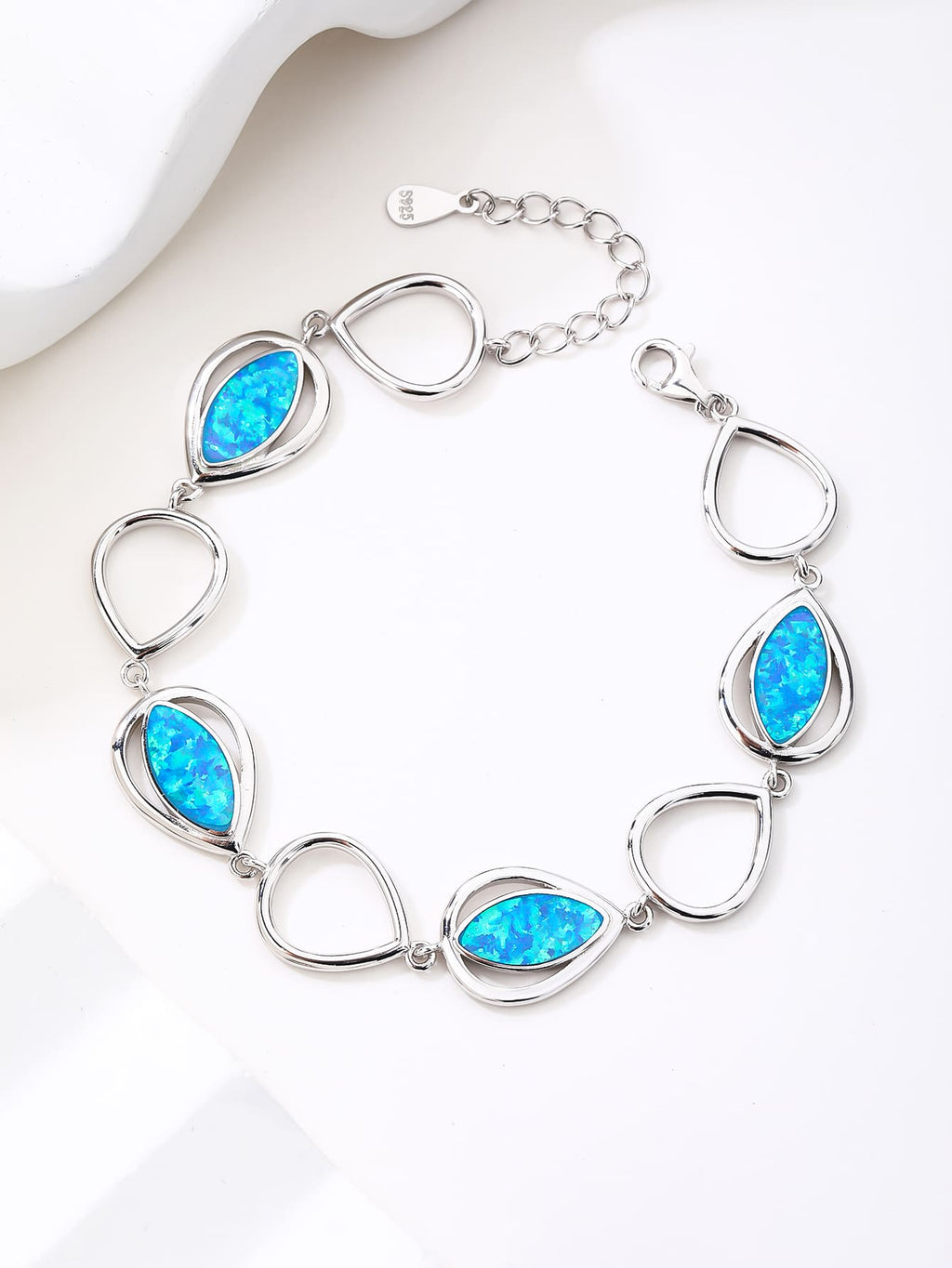 bracelet with drop outline and blue opal stones (16,5+3,5 cm) in hallmarked, rhodium-plated 925 sterling silver – lifestyle view – DRESCHER Jewellery®