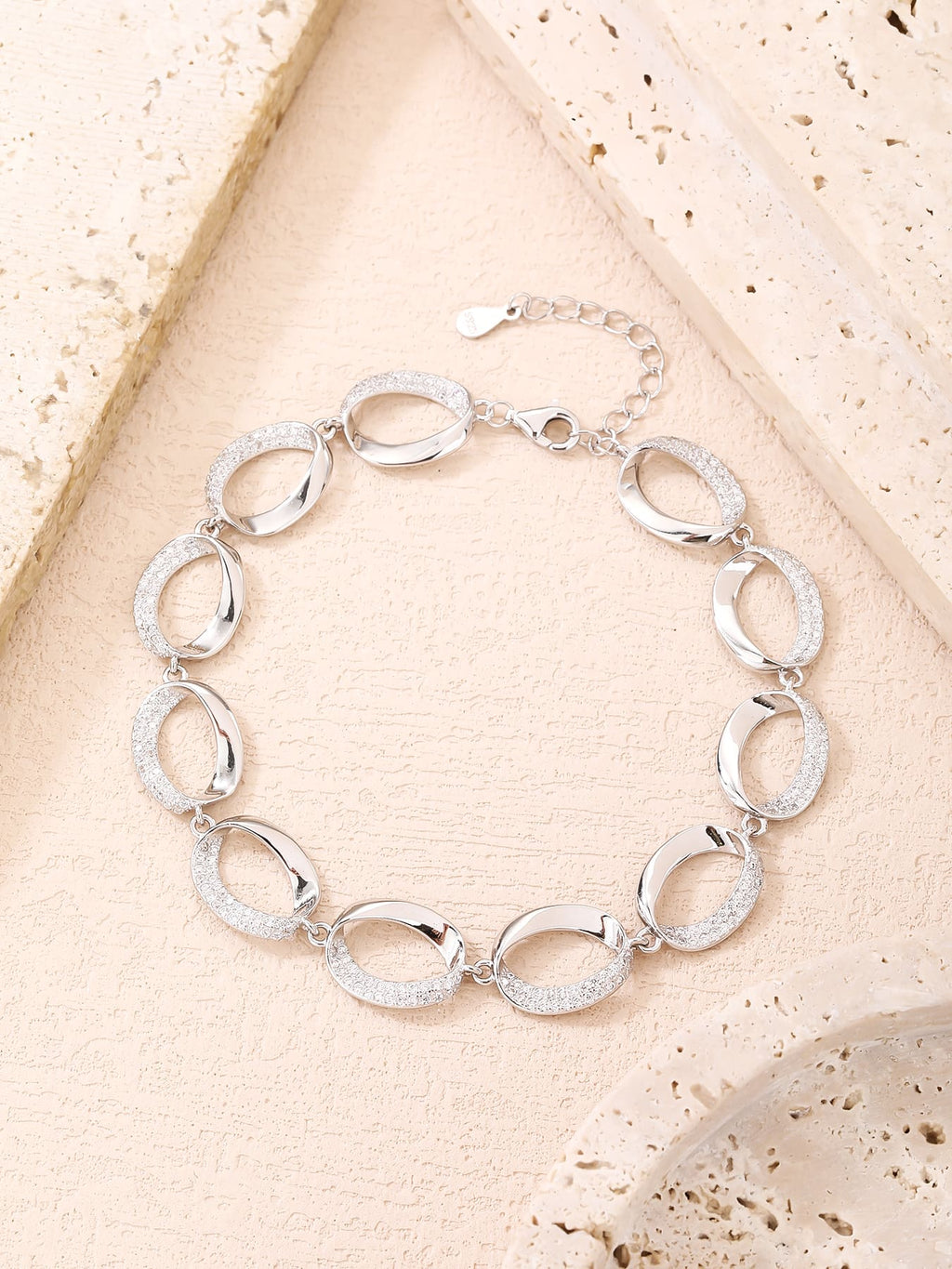 bracelet with oval shaped eyes and zirconia decoration in hallmarked, rhodium-plated 925 sterling silver – display view – DRESCHER Jewellery®