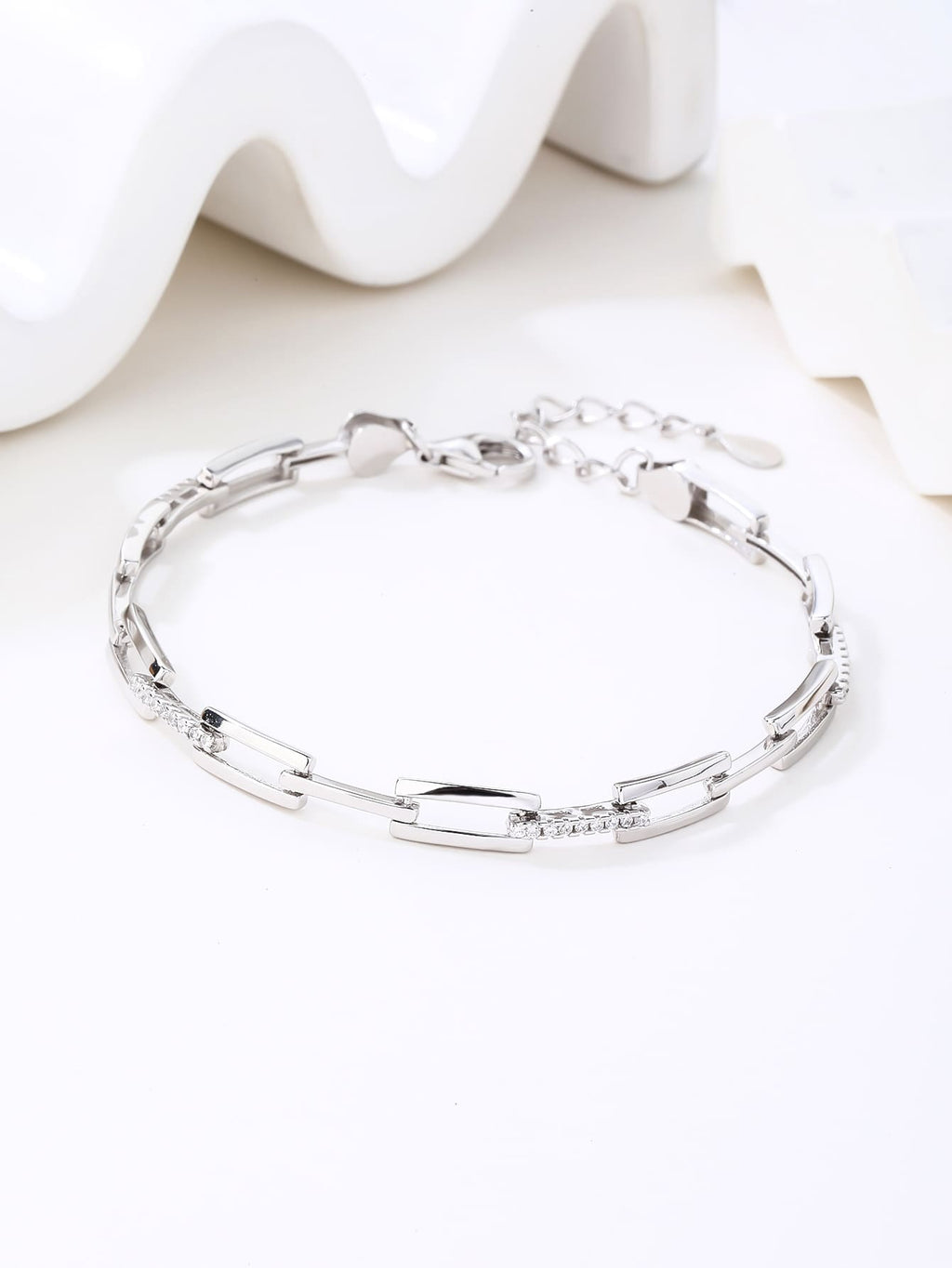 bracelet with rectangle links and cubic zirconia stones (17+4 cm) in hallmarked, rhodium-plated 925 sterling silver – lifestyle view – DRESCHER Jewellery®