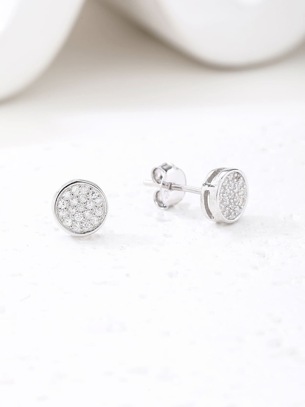 Round pavé white cubic zirconia stud earrings in hallmarked, rhodium-plated 925 sterling silver – display view – DRESCHER Jewellery®