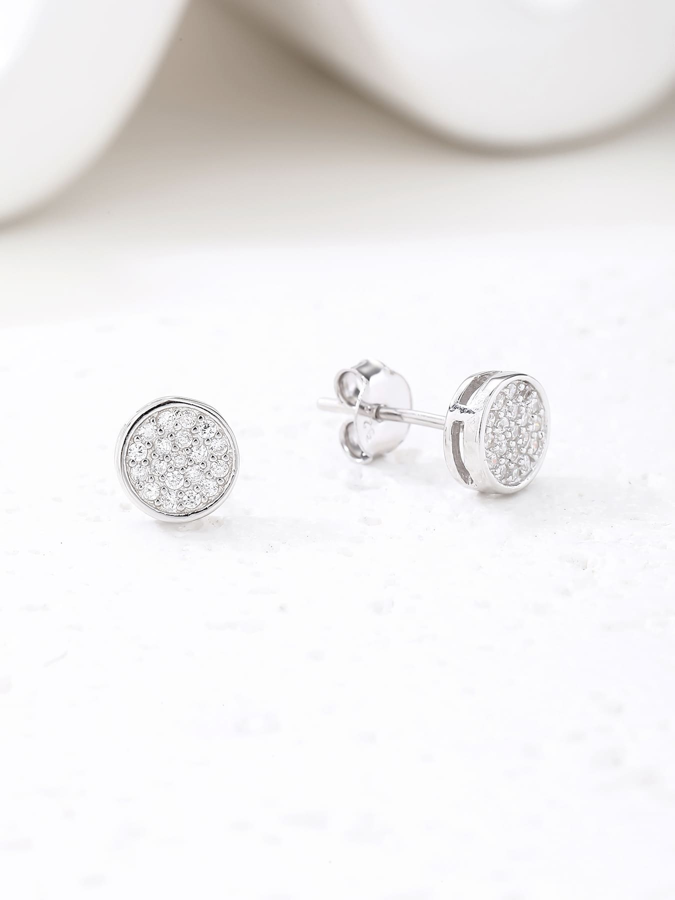 Round pavé white cubic zirconia stud earrings in hallmarked, rhodium-plated 925 sterling silver – display view – DRESCHER Jewellery®