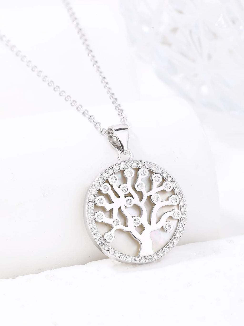 Tree of Life pendant with cubic zirconia decoration and mother-of-pearl inlay, crafted with hallmarked, rhodium-plated 925 sterling silver – display view – DRESCHER Jewellery®