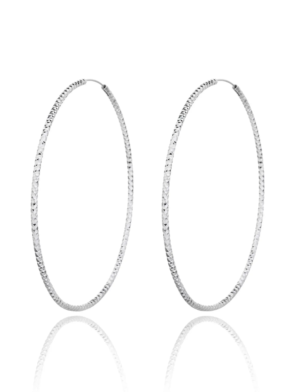 Large diamond-cut hoop earrings in hallmarked, rhodium-plated 925 sterling silver – front view – DRESCHER Jewellery®