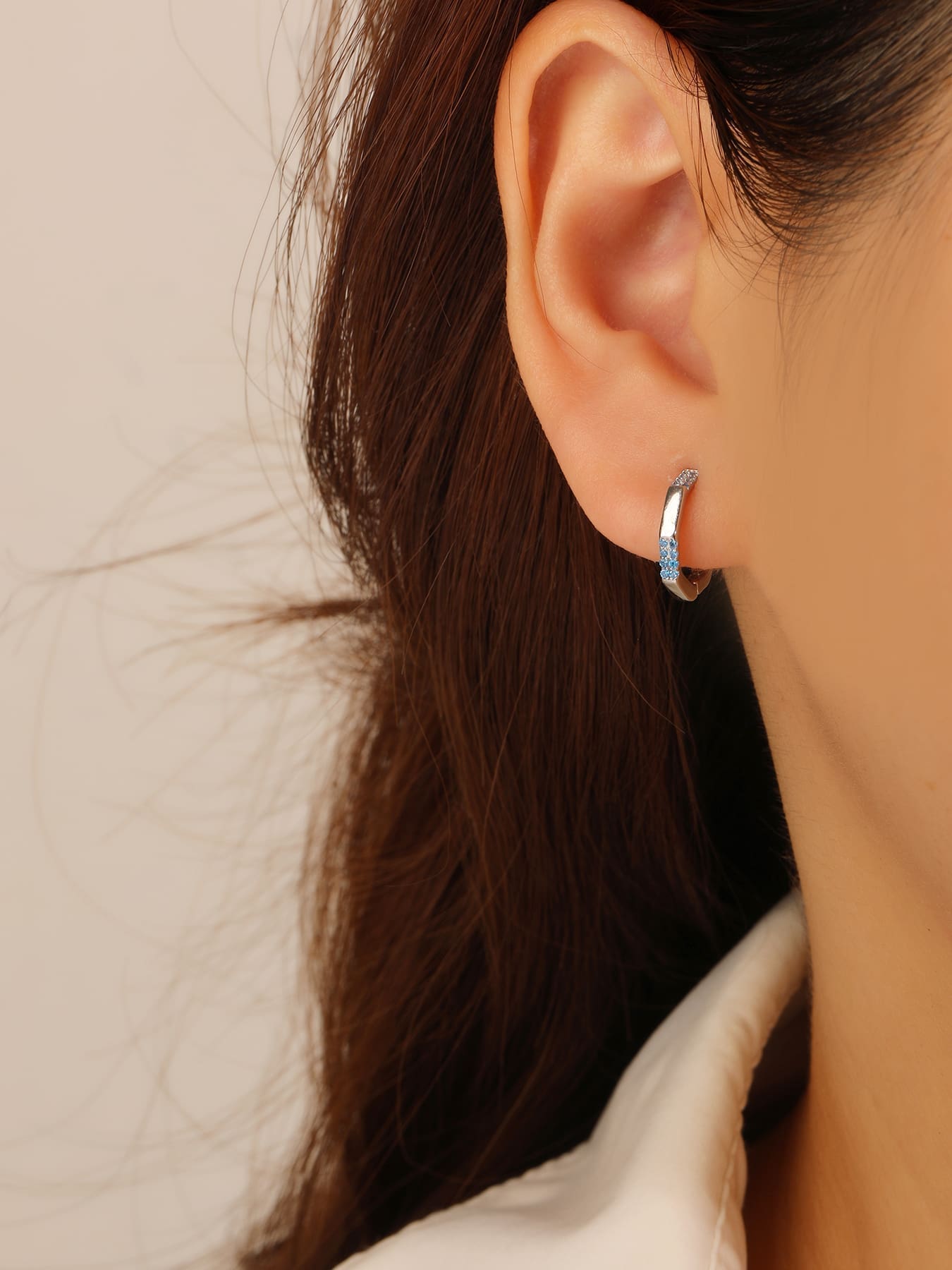 octagonal light blue stone earrings in hallmarked, rhodium-plated 925 sterling silver – worn view – DRESCHER Jewellery®