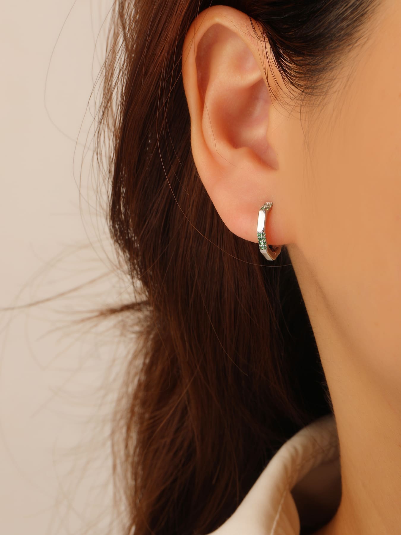 Octagonal green stone hoop earrings in hallmarked, rhodium-plated 925 sterling silver – worn view – DRESCHER Jewellery®