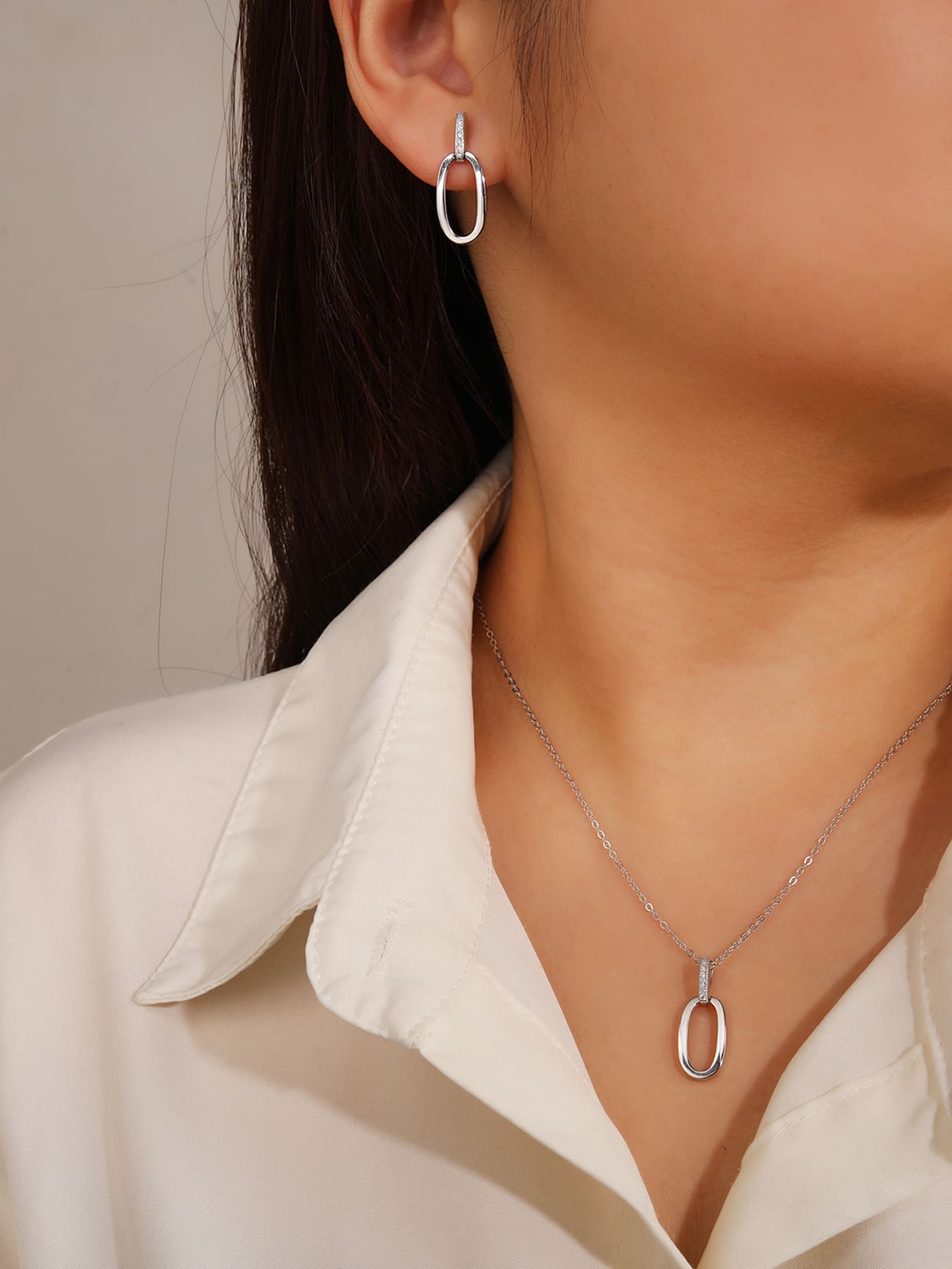 oval jeweled with white cubic zirconia stones in hallmarked, rhodium-plated 925 sterling silver – display view – DRESCHER Jewellery®