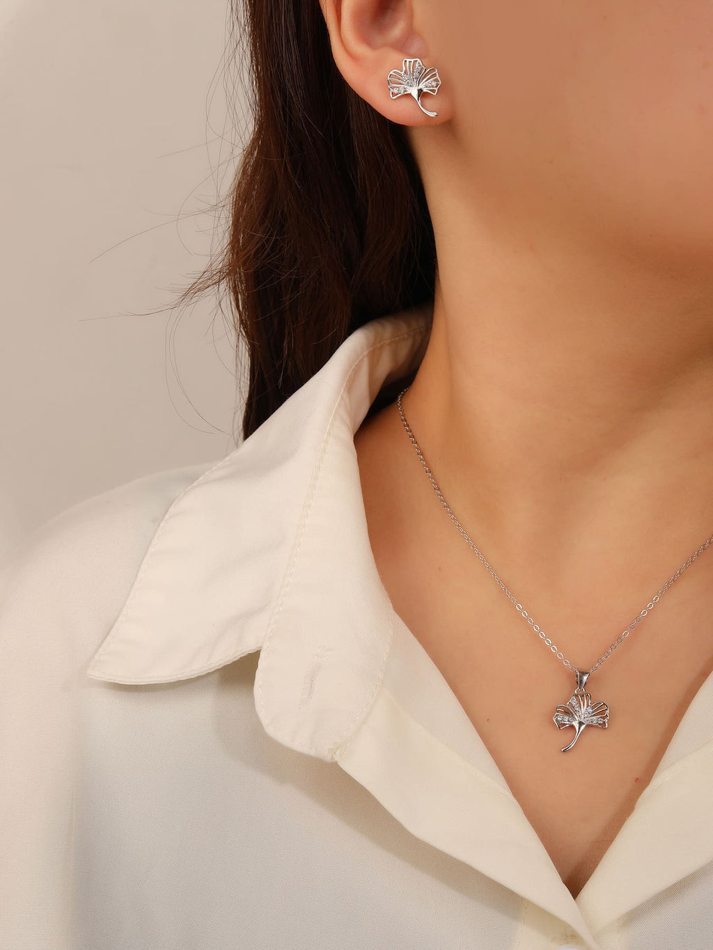 fern leaves with white cubic zirconia in hallmarked, rhodium-plated 925 sterling silver – worn view – DRESCHER Jewellery®