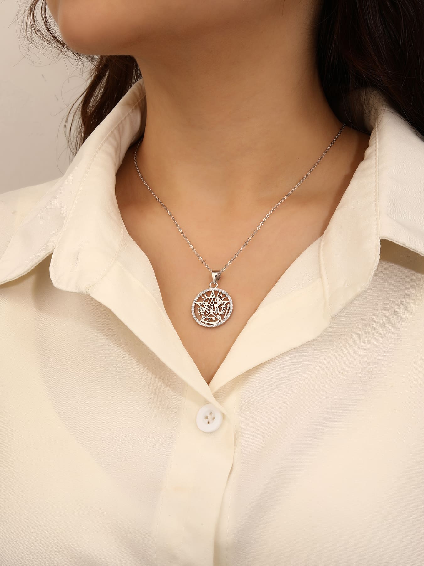 pentagram pendant with sparkling cubic zirconia in hallmarked, rhodium-plated 925 sterling silver – worn view – DRESCHER Jewellery®