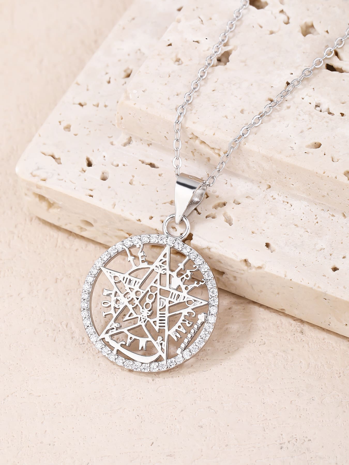 pentagram pendant with sparkling cubic zirconia in hallmarked, rhodium-plated 925 sterling silver – lifestyle view – DRESCHER Jewellery®