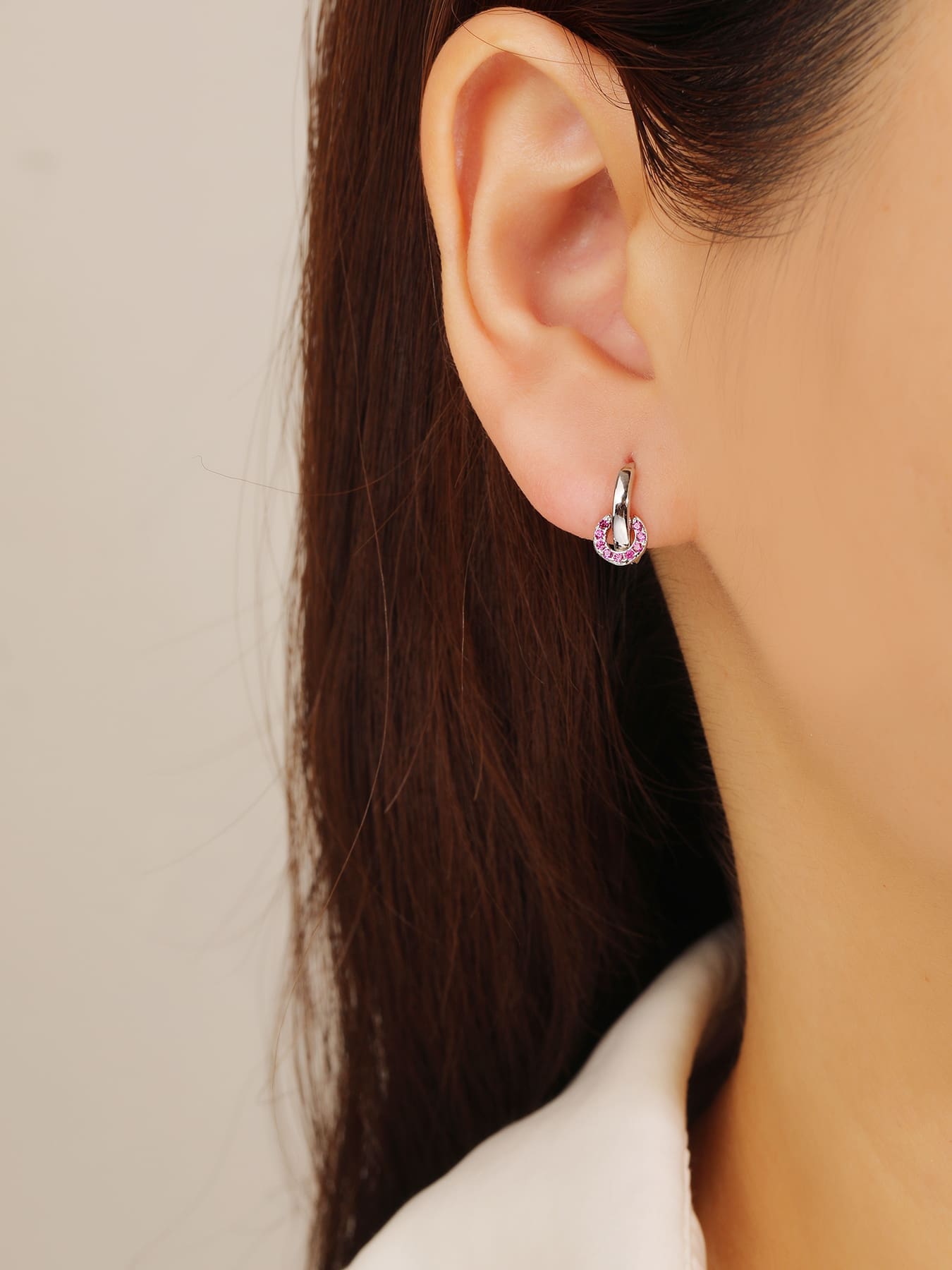 pink cubic zirconia stone hoop earrings in hallmarked, rhodium-plated 925 sterling silver – worn view – DRESCHER Jewellery®