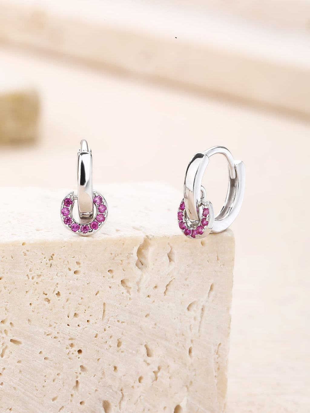 pink cubic zirconia stone hoop earrings in hallmarked, rhodium-plated 925 sterling silver – lifestyle view – DRESCHER Jewellery®