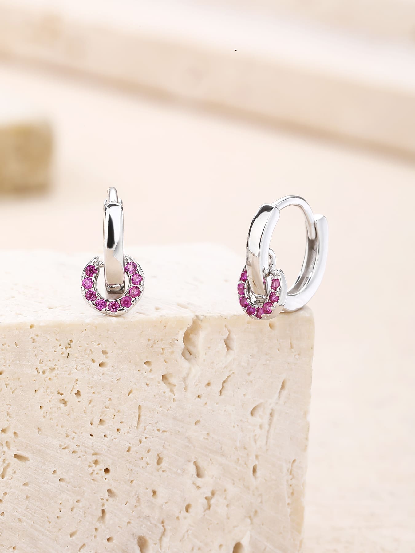 pink cubic zirconia stone hoop earrings in hallmarked, rhodium-plated 925 sterling silver – lifestyle view – DRESCHER Jewellery®