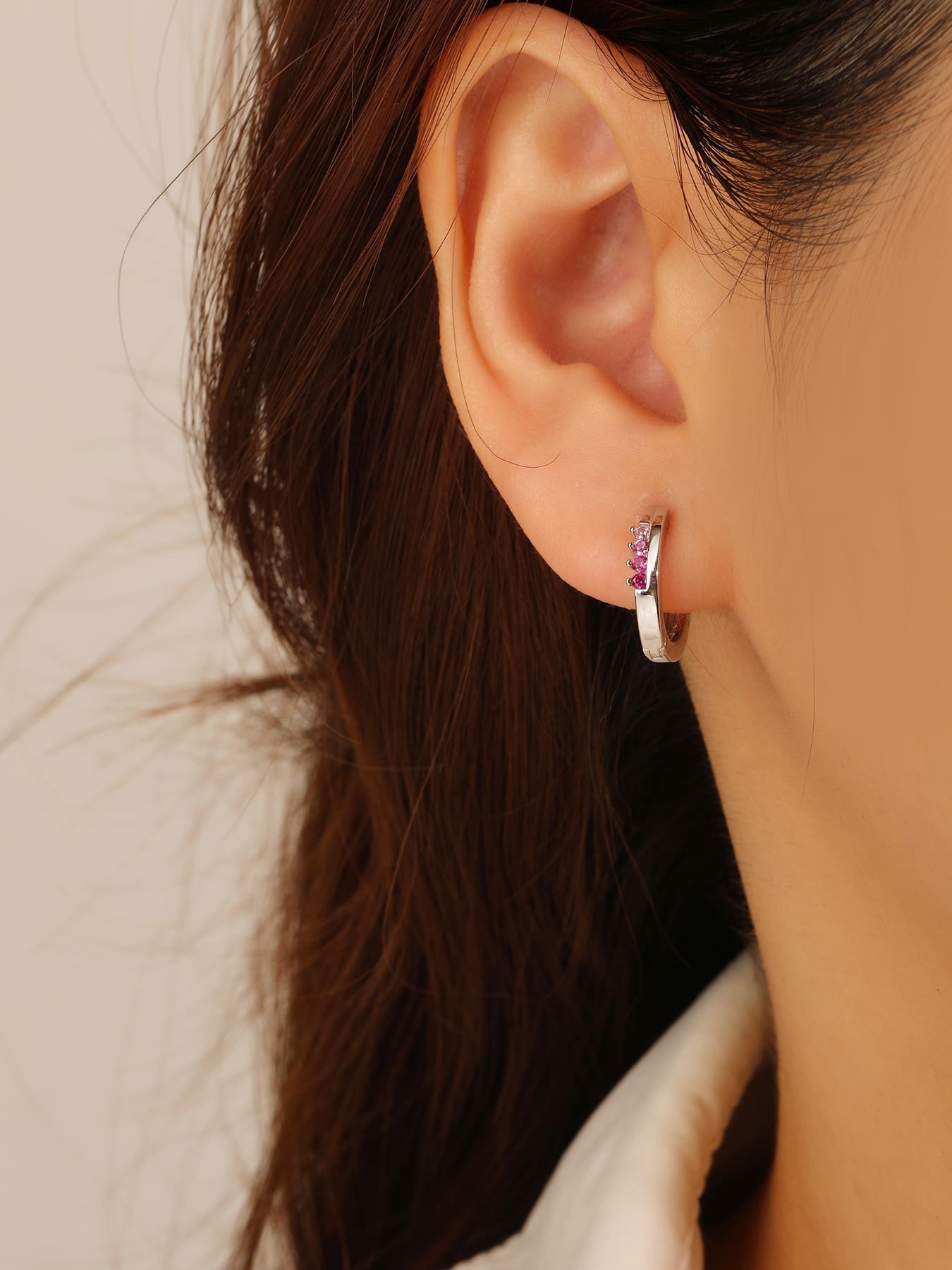 pink - red and pink cubic zirconia stone hoop earrings in hallmarked, rhodium-plated 925 sterling silver – worn view – DRESCHER Jewellery®