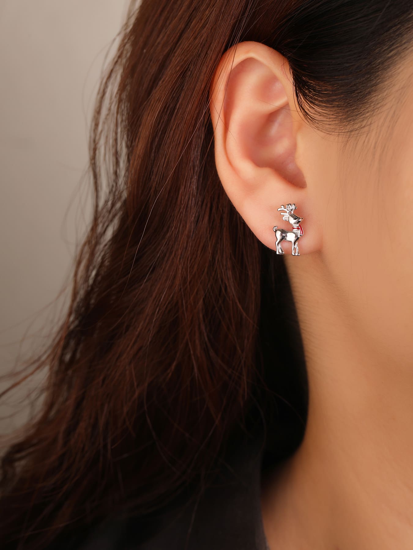 Reindeer stud earrings with red scarf in hallmarked, rhodium-plated 925 sterling silver – worn view – DRESCHER Jewellery®