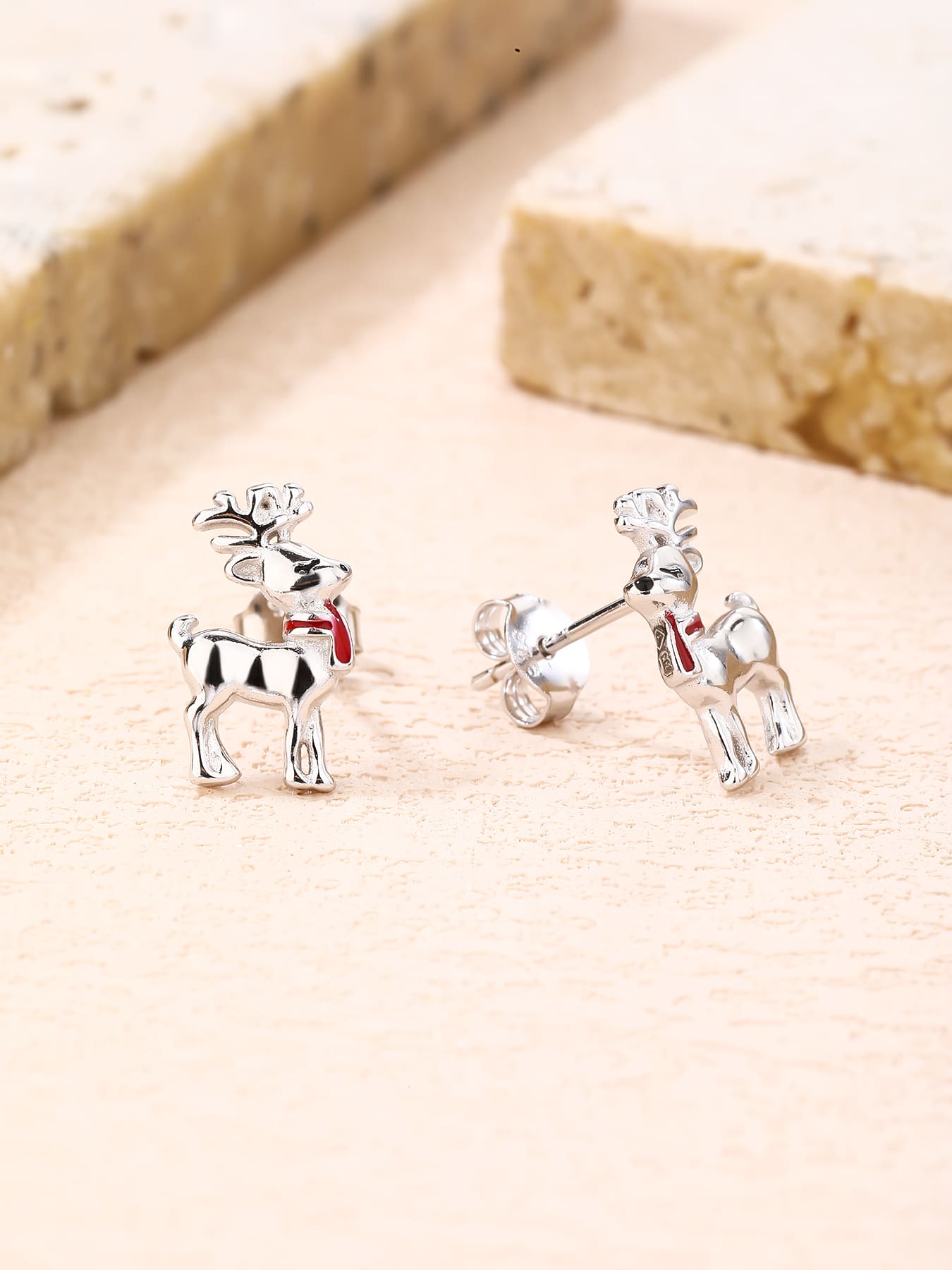 Reindeer stud earrings with red scarf in hallmarked, rhodium-plated 925 sterling silver – display view – DRESCHER Jewellery®