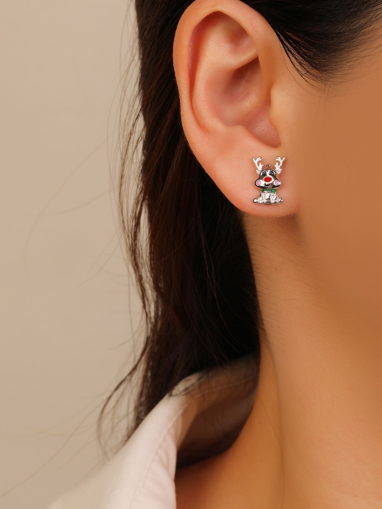 Multicoloured enamel reindeer stud earrings in hallmarked, rhodium-plated 925 sterling silver – worn view – DRESCHER Jewellery®