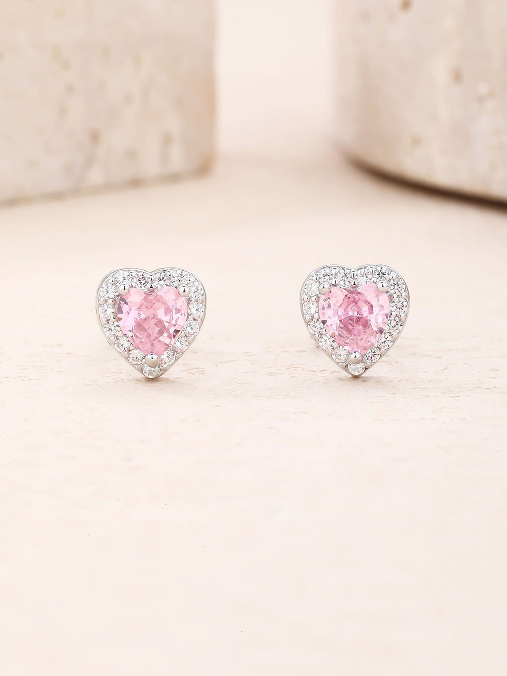 Pink heart and white cubic zirconia stud earrings in hallmarked, rhodium-plated 925 sterling silver – display view – DRESCHER Jewellery®