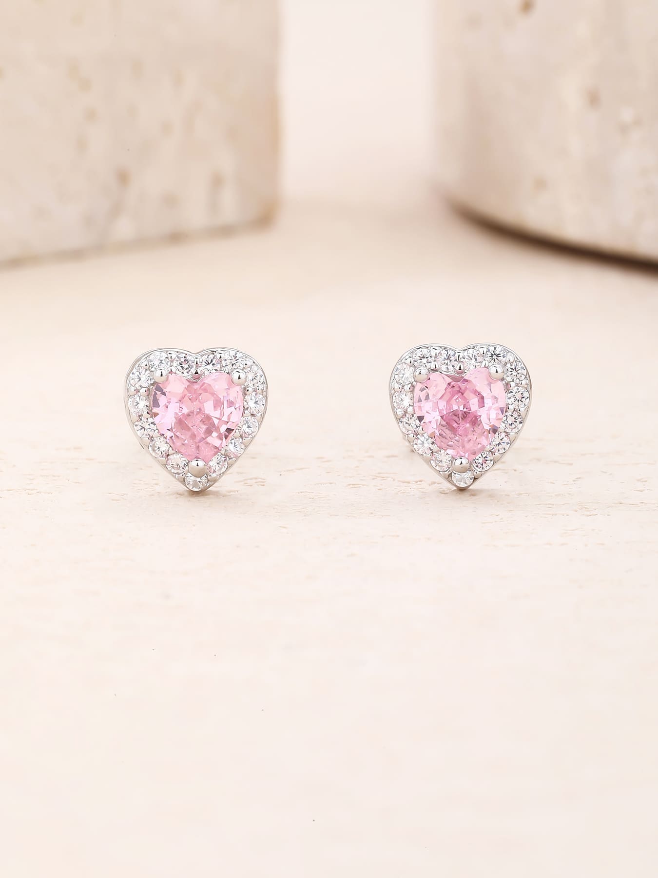 Pink heart and white cubic zirconia stud earrings in hallmarked, rhodium-plated 925 sterling silver – display view – DRESCHER Jewellery®