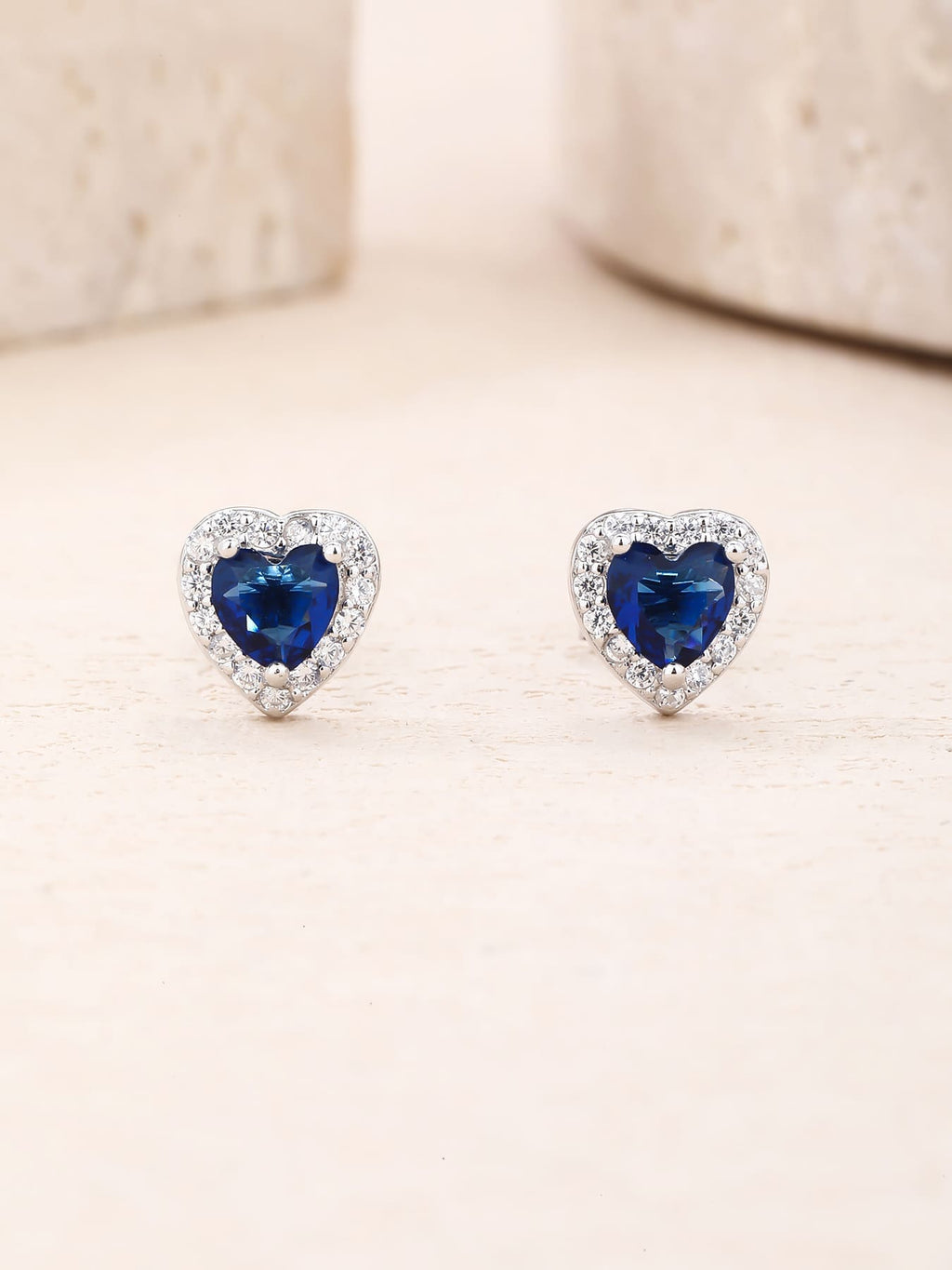 Dark blue heart and white cubic zirconia halo stud earrings in hallmarked, rhodium-plated 925 sterling silver – display view – DRESCHER Jewellery®