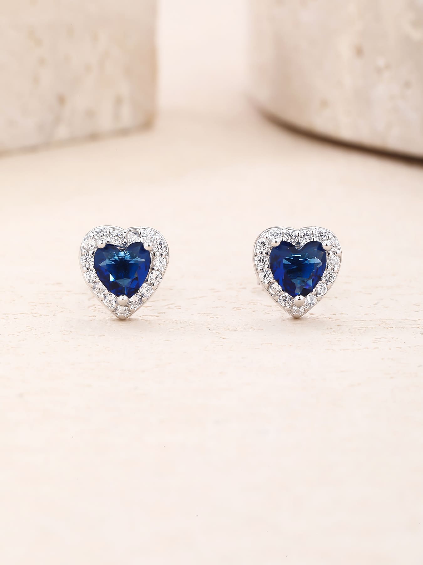 Dark blue heart and white cubic zirconia halo stud earrings in hallmarked, rhodium-plated 925 sterling silver – display view – DRESCHER Jewellery®