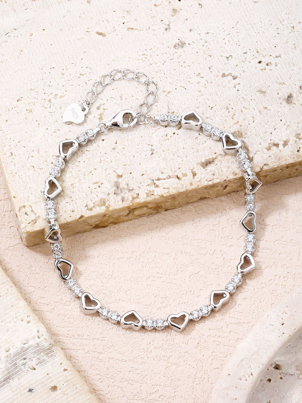 heart bracelet with zirconia stones in hallmarked, rhodium-plated 925 sterling silver – display view – DRESCHER Jewellery®
