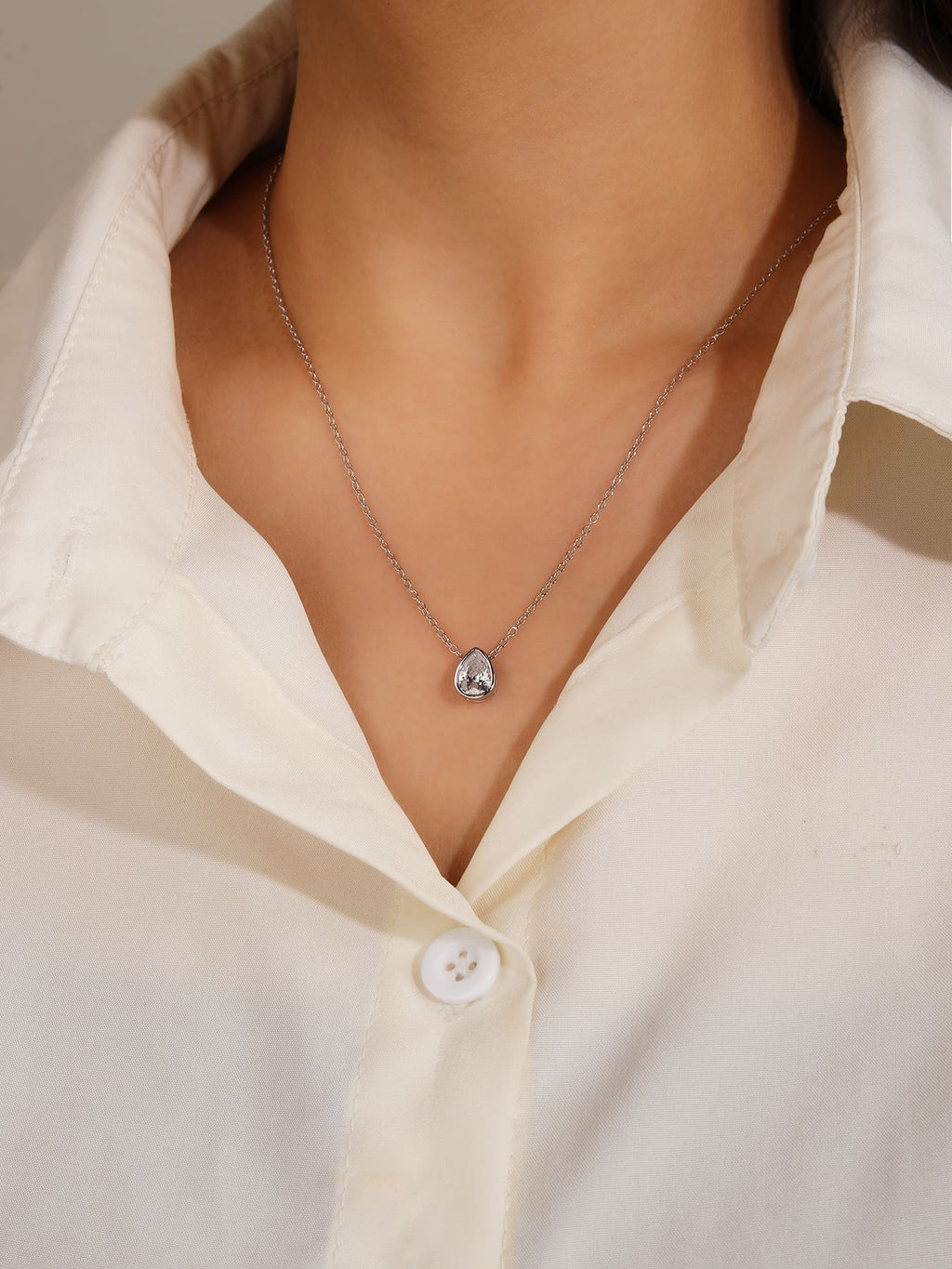 water drop white cubic zirconia necklace in hallmarked, rhodium-plated 925 sterling silver – worn view – DRESCHER Jewellery®
