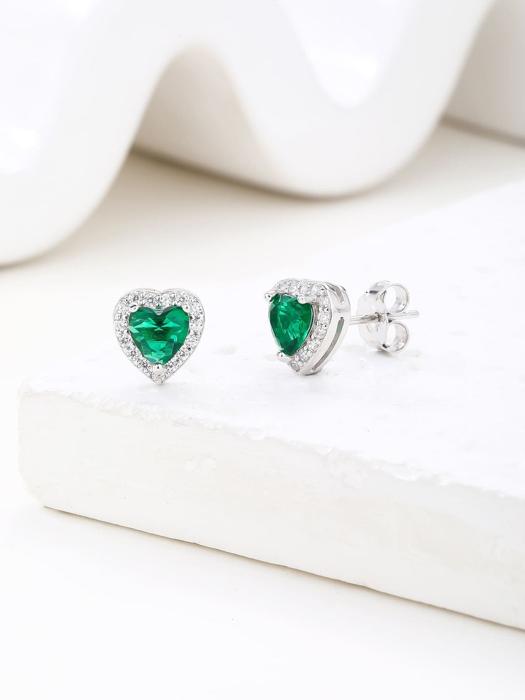 Green heart and white cubic zirconia stud earrings in hallmarked, rhodium-plated 925 sterling silver – display view – DRESCHER Jewellery®
