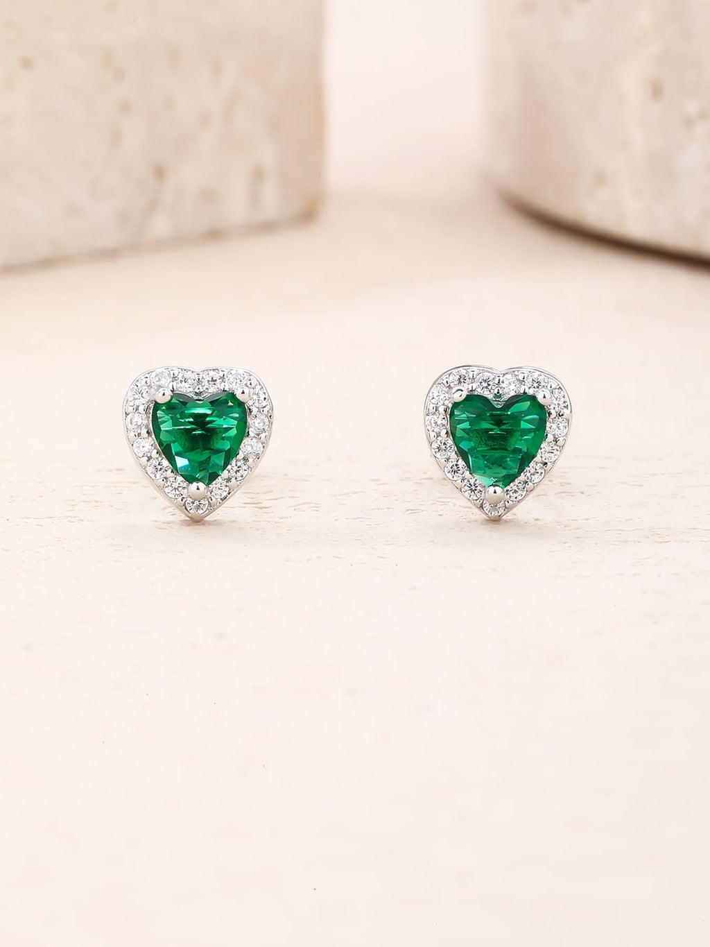 Green heart and white cubic zirconia stud earrings in hallmarked, rhodium-plated 925 sterling silver – lifestyle view – DRESCHER Jewellery®