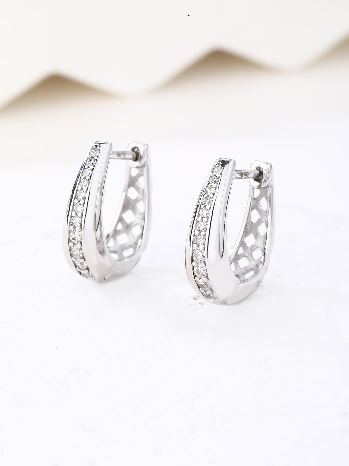 Double-row white cubic zirconia hoop earrings in hallmarked, rhodium-plated 925 sterling silver – display view – DRESCHER Jewellery®