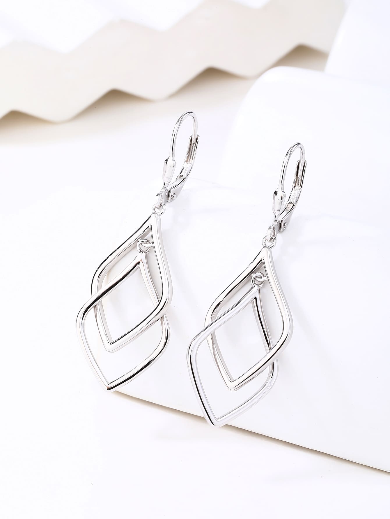 geometric double-diamond dangle earrings in hallmarked, rhodium-plated 925 sterling silver – display view – DRESCHER Jewellery®