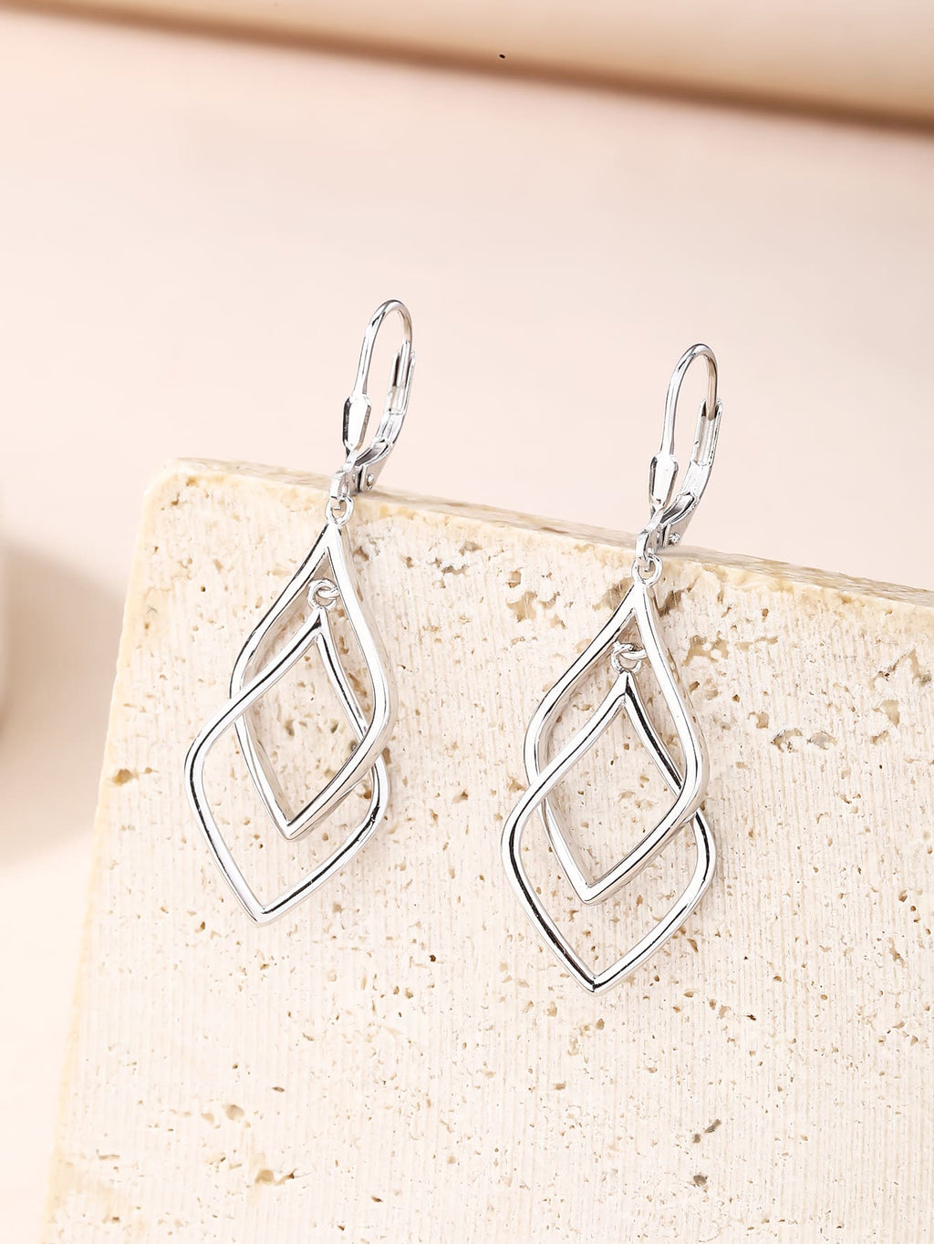 geometric double-diamond dangle earrings in hallmarked, rhodium-plated 925 sterling silver – lifestyle view – DRESCHER Jewellery®
