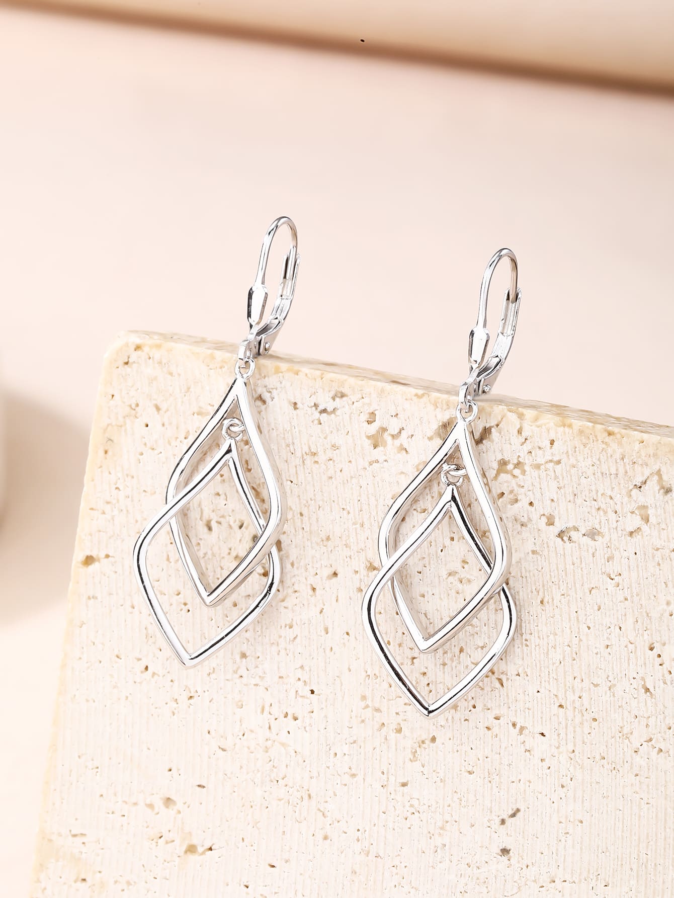 geometric double-diamond dangle earrings in hallmarked, rhodium-plated 925 sterling silver – lifestyle view – DRESCHER Jewellery®