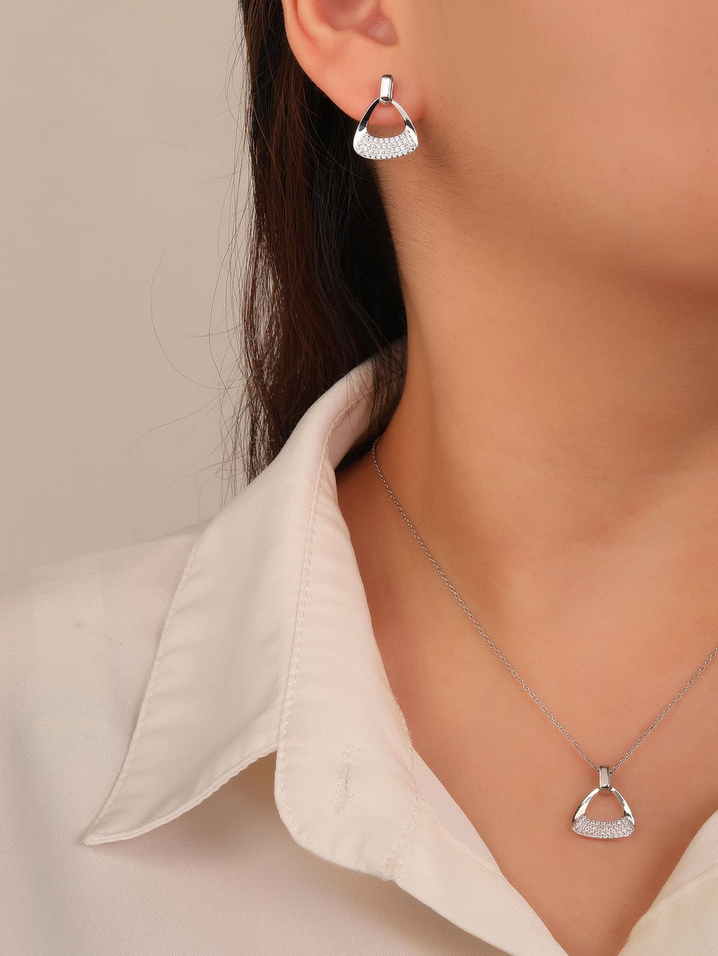 Triangular shaped jewel set with white cubic zirconia stones in hallmarked, rhodium-plated 925 sterling silver – worn view – DRESCHER Jewellery®