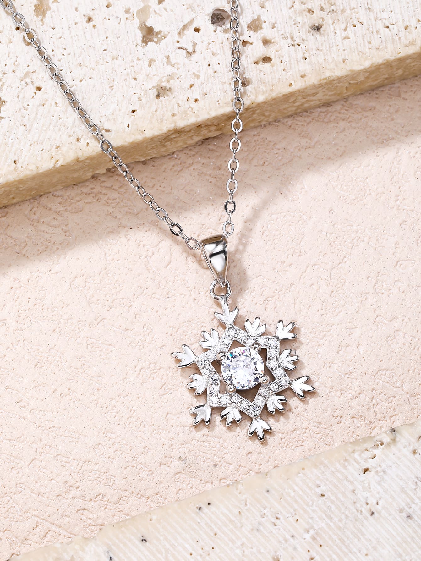 Snowflake pendant - AG 925 (without chain) in hallmarked, rhodium-plated 925 sterling silver – lifestyle view – DRESCHER Jewellery®