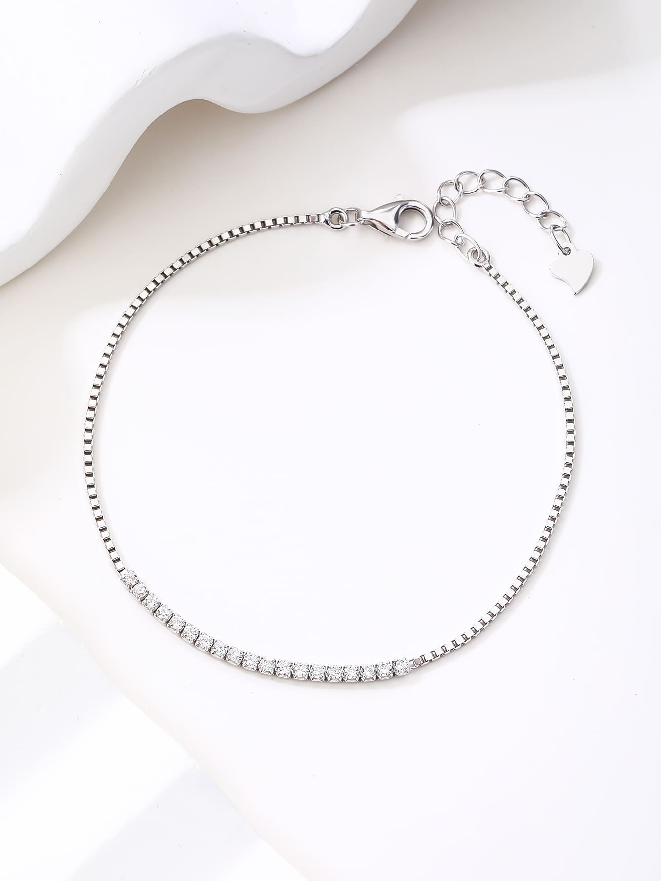 Bracelet with white cubic zirconia stones in hallmarked, rhodium-plated 925 sterling silver – lifestyle view – DRESCHER Jewellery®
