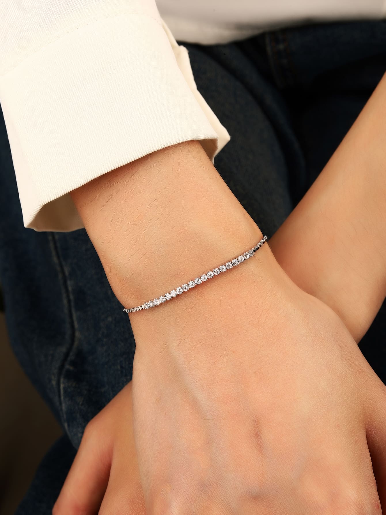 Bracelet with white cubic zirconia stones in hallmarked, rhodium-plated 925 sterling silver – worn view – DRESCHER Jewellery®