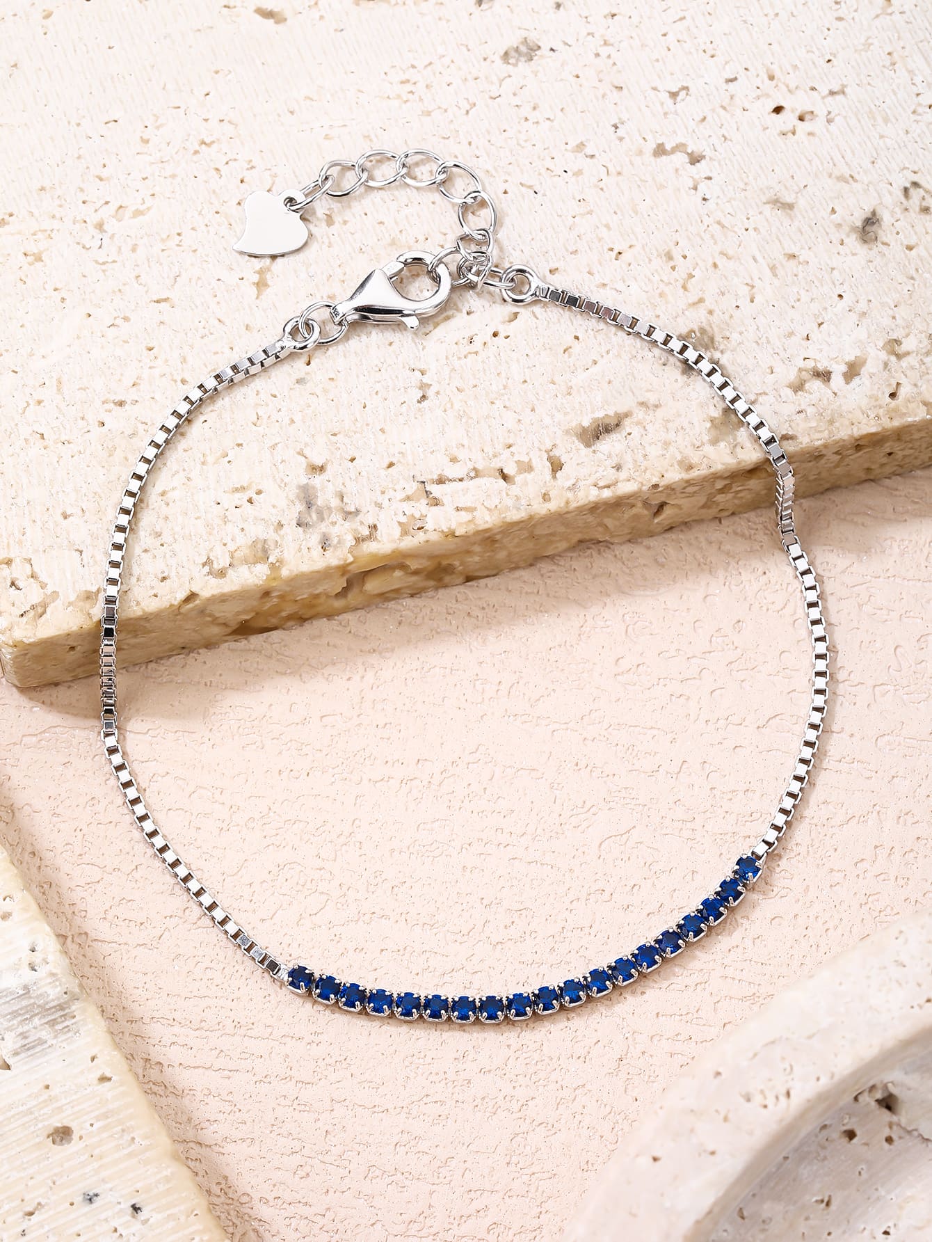 Bracelet with blue zirconia stones in hallmarked, rhodium-plated 925 sterling silver – alternate front view – DRESCHER Jewellery®
