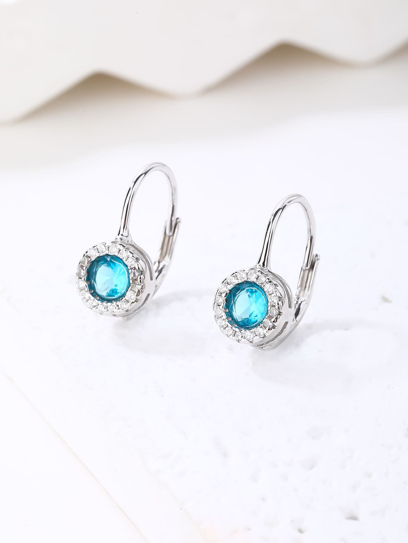 blue cubic zirconia stud earrings in hallmarked, rhodium-plated 925 sterling silver – lifestyle view – DRESCHER Jewellery®
