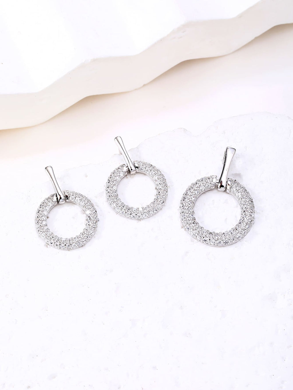 Circular cubic zirconia bezel set - sparkle every moment in hallmarked, rhodium-plated 925 sterling silver – display view – DRESCHER Jewellery®