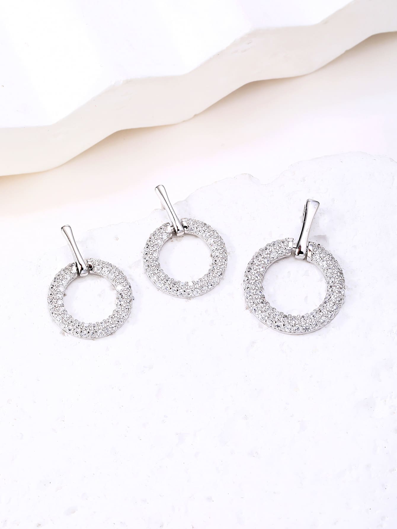Circular cubic zirconia bezel set - sparkle every moment in hallmarked, rhodium-plated 925 sterling silver – display view – DRESCHER Jewellery®