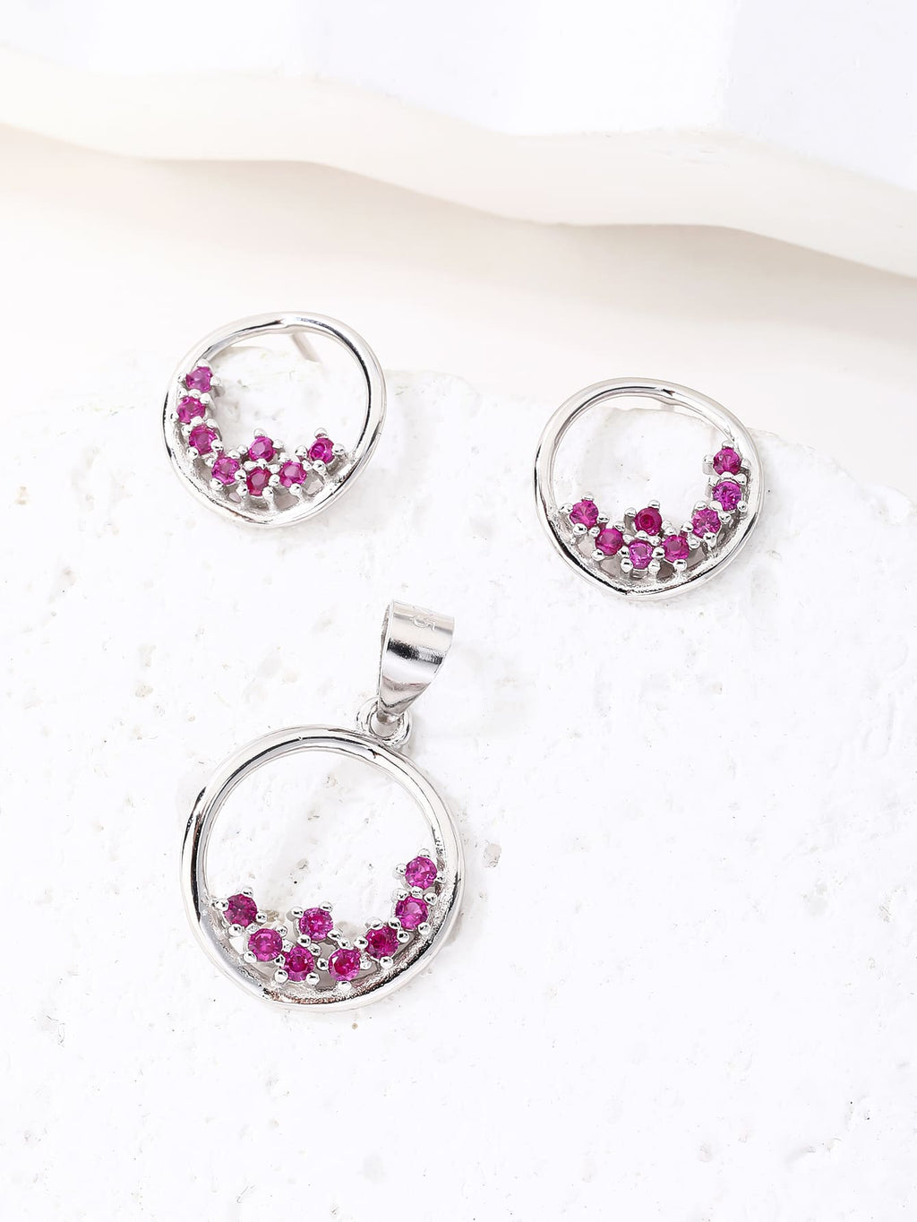 Circular fuchsia red stone bezel set - strength and elegance in hallmarked, rhodium-plated 925 sterling silver – lifestyle view – DRESCHER Jewellery®