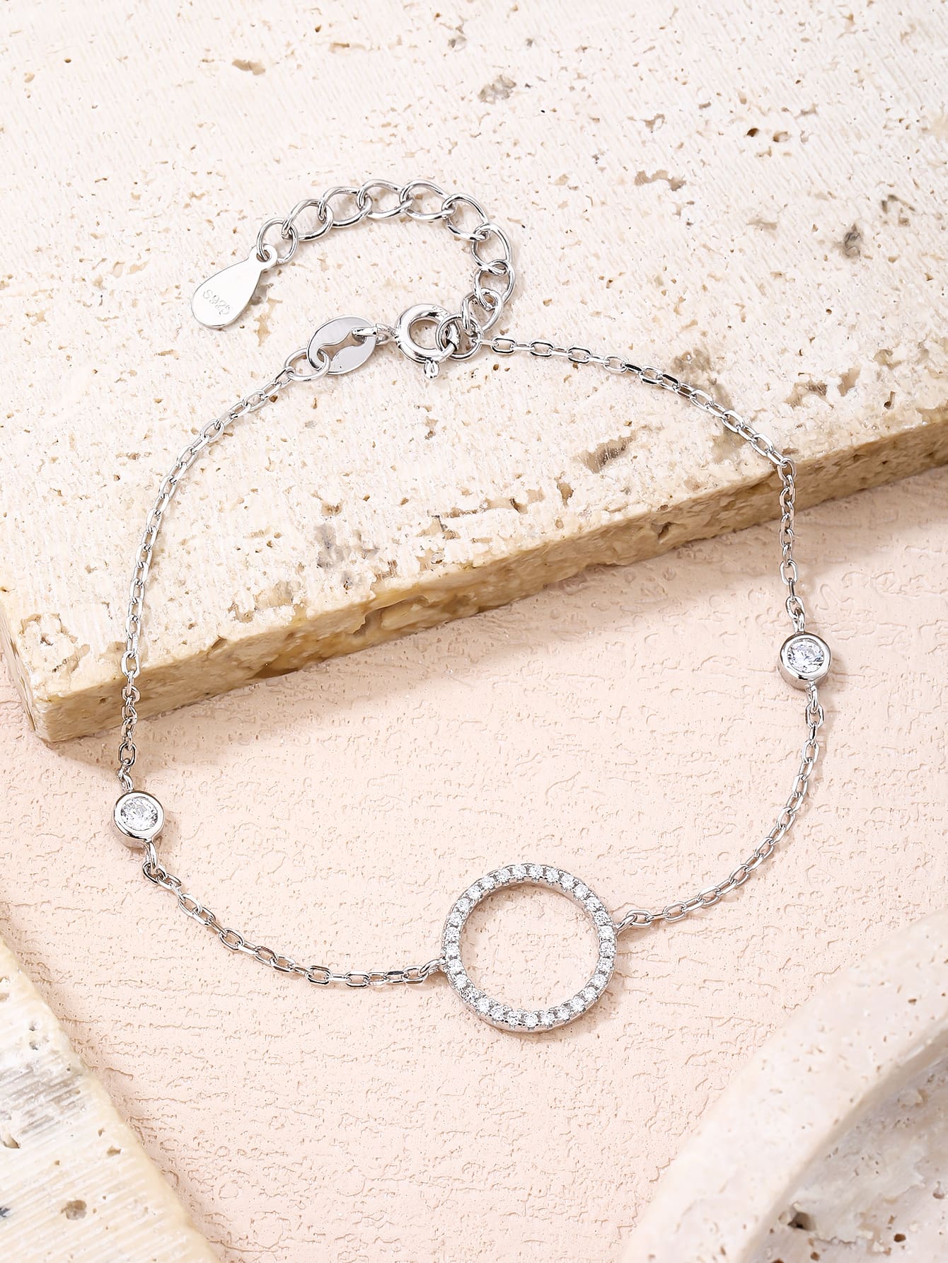 Circle motif bracelet with zirconia stones in hallmarked, rhodium-plated 925 sterling silver – worn view – DRESCHER Jewellery®