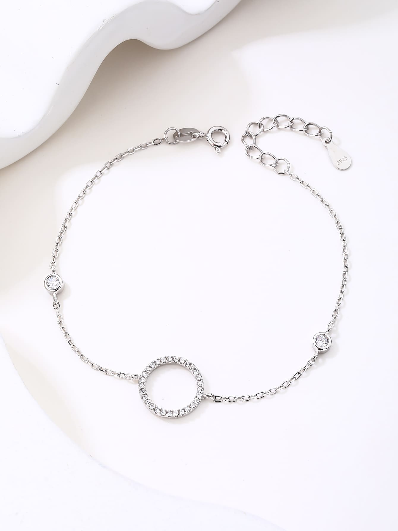 Circle motif bracelet with zirconia stones in hallmarked, rhodium-plated 925 sterling silver – display view – DRESCHER Jewellery®